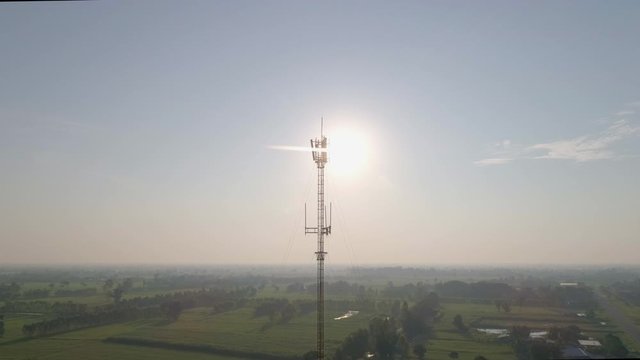 aerial view to cellular antenna, Tower with antennas for cell phone,View from flying drone.4K Shot.