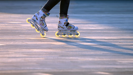 silhouette pairs of legs on roller skates