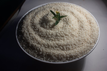 Healthy food, rice put in a bowl and the flower in the top of the rice to add the beautiful of the rice