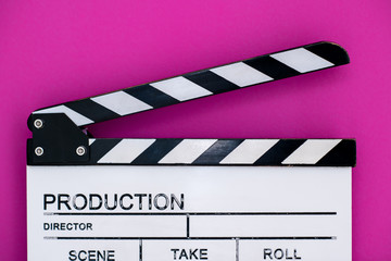 movie clapper on pink purple violet background