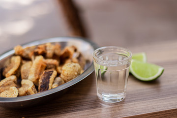 bottle and glass of beer on wooden table