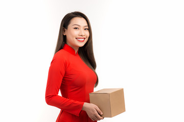 Vietnamese woman with the traditional costume holding gift box