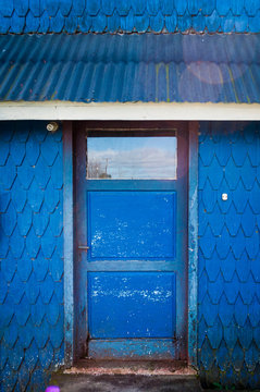Blue house in village