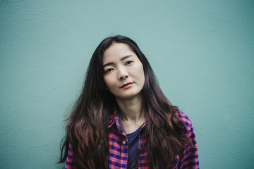 Obraz premium portrait happy cheerful young brunette asian woman with perfect smilling,clean skin.beautiful girl posing show white teeth smile relaxing.fashion people freedom life style concept