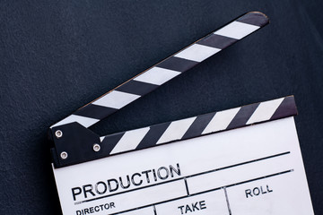 movie clapper on black chalkboard background
