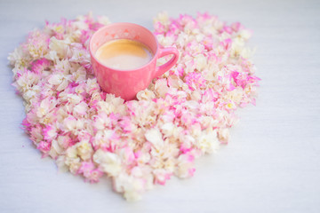 Cup coffee on pink Bougainvillea