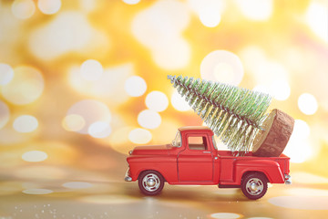 Christmas tree on toy car. Christmas holiday celebration concept
