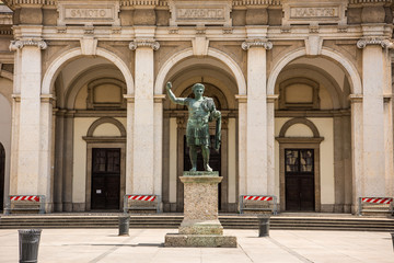 Fototapeta na wymiar Monument To Roman Emperor Constantine I, in front of San Lorenzo Maggiore basilica in downtown of Milan, Italy