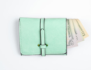 Trendy leather wallet with dollar bills on white background.
