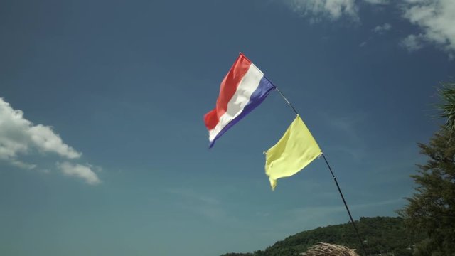 Shot of waving flag of Thailand in Phuket Thailand on windy day in daylight in the summer