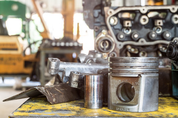 Piston of the diesel engine on working table