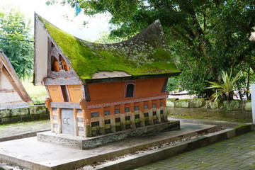 The tomb of the family of the former king Sidabutar, Tomok, Samosir, Indonesia. Translation: Name of the king in indonesian on the tomb