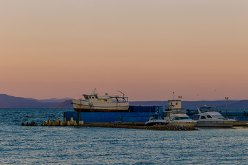 Boat parking in the center of Vladivostok. Boats stand on land during the winter