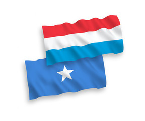 Flags of Somalia and Luxembourg on a white background