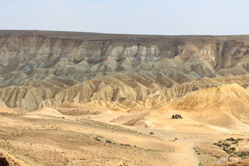 Negev desert mountain panorama with hiking group, Israel