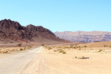 Fototapeta na wymiar Mountain panorama with road to Timna Valley Park in Negev Desert near Eilat, Israel
