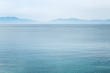Calm blue sea and skyline. Beautiful landscape. Space for text. Background.