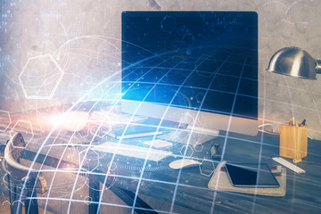 Multi exposure of table with computer and world map hologram. International data network concept.
