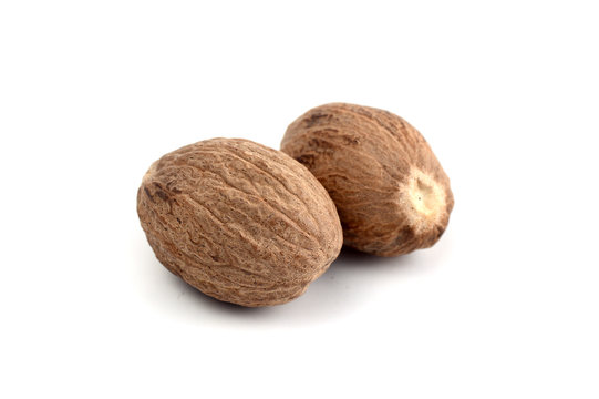 Nutmeg isolated on white background. Close up.