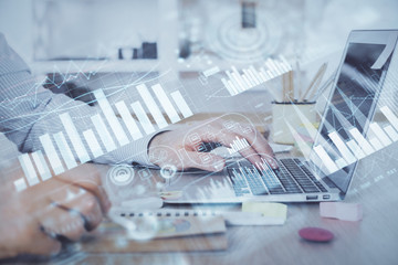 Multi exposure of stock market chart with man working on computer on background. Concept of financial analysis.