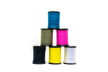 Colorful of cotton sewing thread isolated on white background. Concept for tailor equipment ,Needlework ,Garment shop.