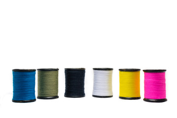 Colorful of cotton sewing thread isolated on white background. Concept for tailor equipment ,Needlework ,Garment shop.