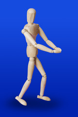 Wooden toy figure cupped hands on blue