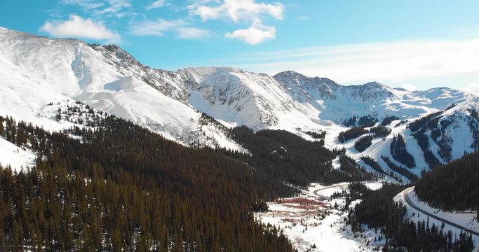 Sun Shines Upon The Beautiful, Snowy Mountains of Loveland Pass, 4K