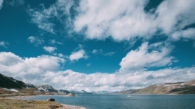 Oppland, Tyin Lake, Norway. Stones On Coast Of Beautiful Lake Tyin In Summer Day. Norwegian Nature. 4K