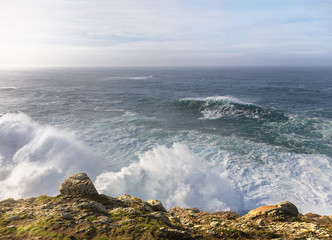 Large waves hit the high cliffs of the Spanish Atlantic coast and spray and haze developed. The waves are very high and roll over. The exciting coast in Galicia in northern Spain.