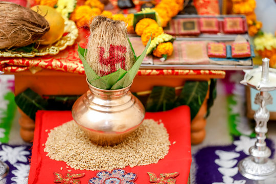 Indian wedding ceremony : decorative coper kalash with green leaf and coconut 