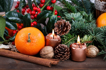Fototapeta na wymiar Christmas decoration with fir, oranges and cones.