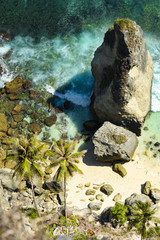 View from above, stunning aerial view of the beautiful Diamond Beach bathed by a turquoise sea. Diamond Beach is an untouched, white-sand and silky blue water bay on the eastern tip of Nusa Penida.