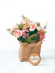 beautiful pink flowers bouquet and heart decor on white background. Holiday spring season, festive design. Valentine's day concept. copy space. template for design