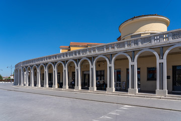 Fototapeta na wymiar 1930s colonnade in a rationalist style building in Tresigallo, called 