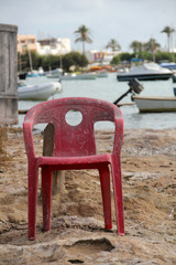 Obraz na płótnie Canvas alone chair in the harbour