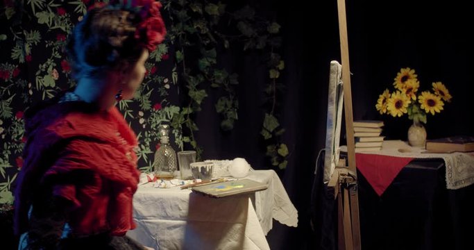 Young Frida Kahlo sits down in her room and starts painting, 4k