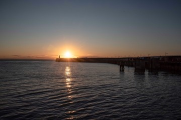 Fototapeta na wymiar Folkestone's Harbour Arm at sunrise.