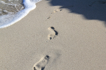 waves and footsteps at the beach