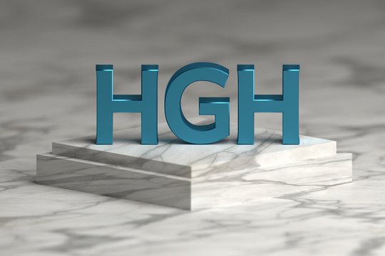 Bold blue letters HGH abbreviation of human growth hormone standing on marble pedestal