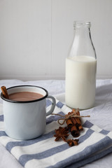 cup with tasty chocolate milk on a wooden table. Milk drink