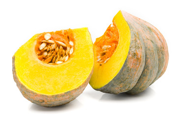 Asian pumpkin species cut in half on a white background.