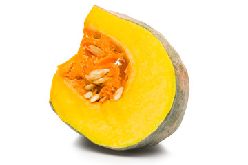 Asian pumpkin species cut in half on a white background with clipping path.