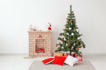 Fireplace and Christmas tree with presents in living room