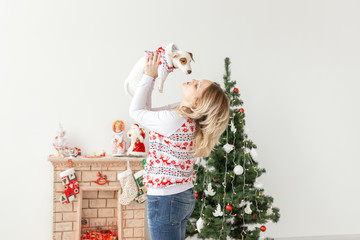Pets, christmas and animal concept - Pretty woman with funny puppy Jack Russell Terrier