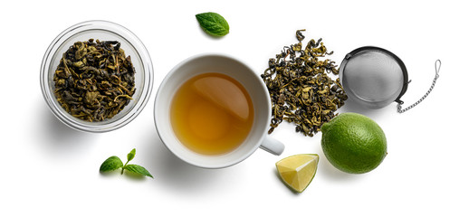 Green tea and accessories top view on white background