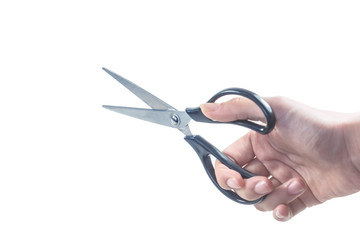 The close-up holds an open pair of scissors.