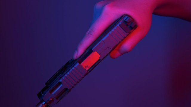 chambering a 9mm round in a pistol.