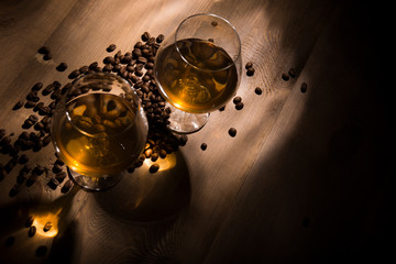 A glass of brandy on a wooden background