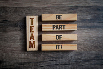 Wooden pieces with TEAM and message be part of it